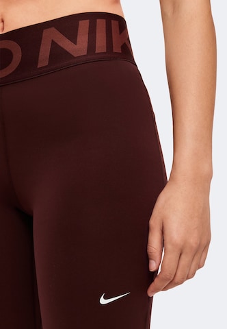 sarkans NIKE Šaurs Sporta bikses: no sāniem