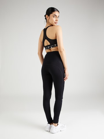 Skinny Pantaloni sportivi 'TUNDRA175' di super.natural in nero