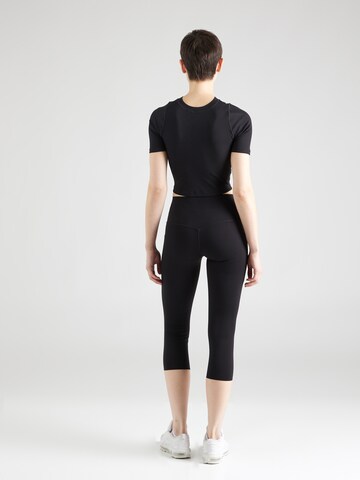 Skinny Pantalon de sport 'UNIVERSA' NIKE en noir