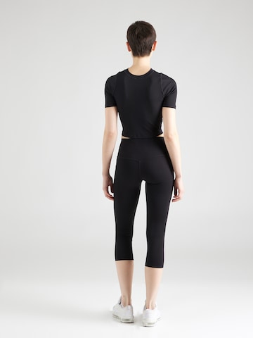 NIKE Skinny Spodnie sportowe 'UNIVERSA' w kolorze czarny