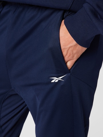 Effilé Pantalon de sport Reebok en bleu