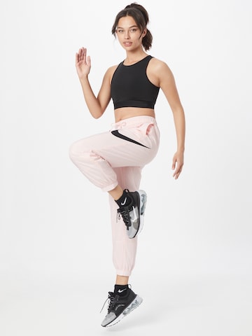 Nike Sportswear Tapered Pants 'Essential' in Pink