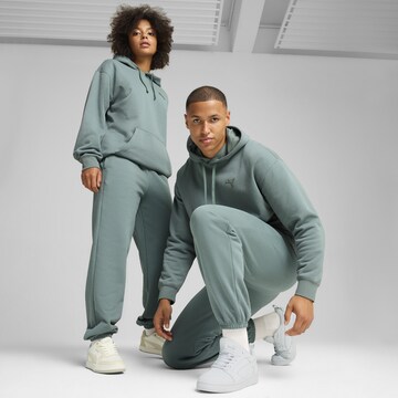 PUMA Tapered Sporthose in Grün