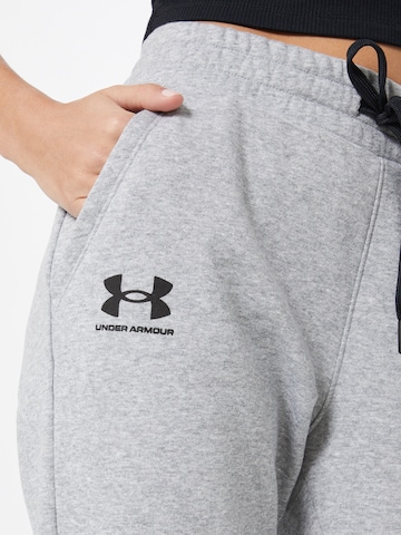 Effilé Pantalon de sport 'Rival' UNDER ARMOUR en gris