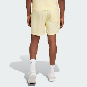 ADIDAS SPORTSWEAR Regular Workout Pants 'Essentials Chelsea' in Yellow