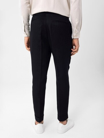 Antioch Tapered Pleat-Front Pants in Black