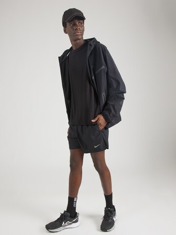 Nike Sportswear Between-season jacket 'Tech' in Black