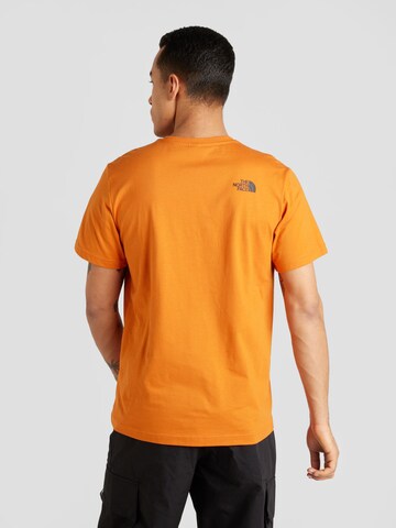T-Shirt 'NEVER STOP EXPLORING' THE NORTH FACE en marron