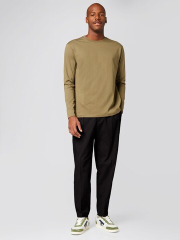 ABOUT YOU x Alvaro Soler Regular Trousers with creases 'Emir' in Black