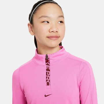 NIKE - Camiseta funcional en rosa