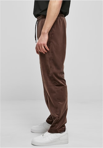 Karl Kani Regular Trousers in Brown