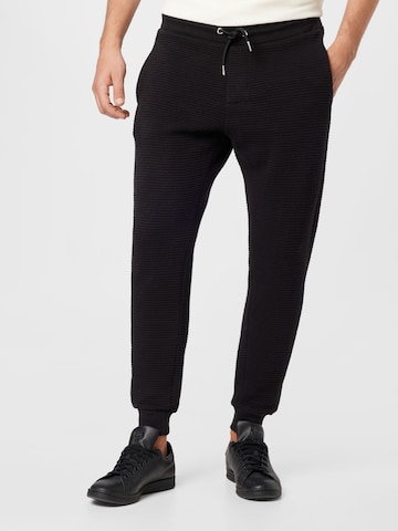 BURTON MENSWEAR LONDON Tapered Trousers 'Ottoman' in Black: front