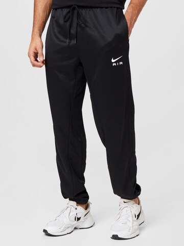 Nike Sportswear Tapered Pants in Black: front