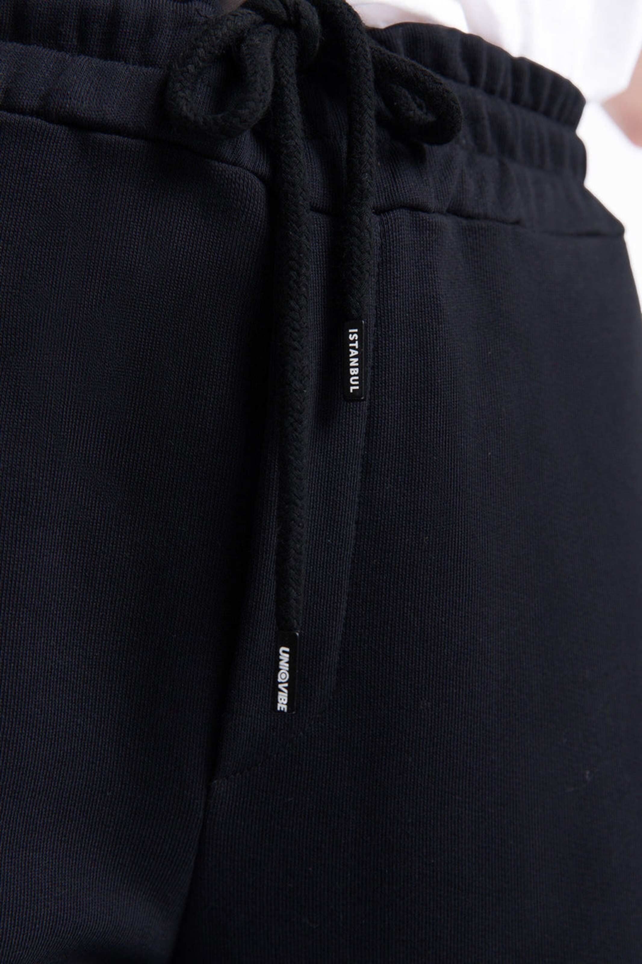 UNIQVIBE Tapered Trousers in Black