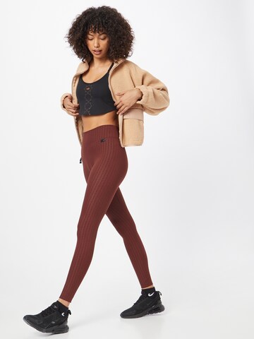 NIKE Skinny Sportovní kalhoty 'ONE LUXE' – bronzová