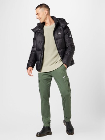 juoda Calvin Klein Jeans Žieminė striukė 'Essential'