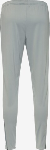 Slimfit Pantaloni sportivi 'Academy' di NIKE in grigio
