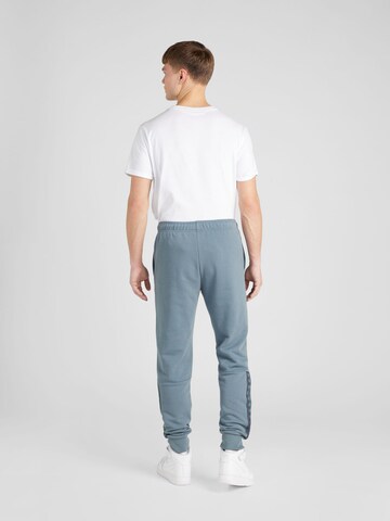 Champion Authentic Athletic Apparel Tapered Trousers in Grey