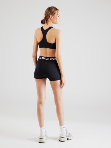 NIKE - Skinny Pantalón deportivo en negro