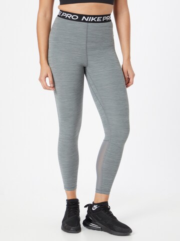 Skinny Pantalon de sport NIKE en gris : devant