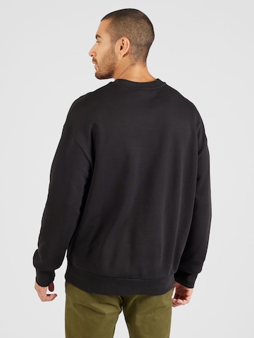 Calvin KleinSweater majica 'HERO' - crna boja