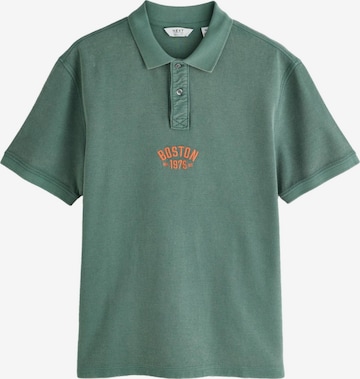 Next T-shirt i grön: framsida