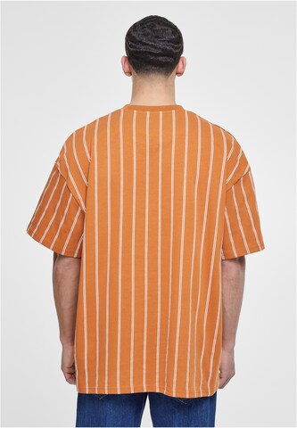 Tricou de la Karl Kani pe portocaliu