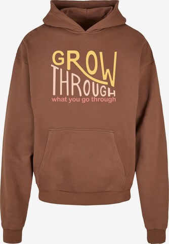 Sweat-shirt 'Spring - Grow Through 2' Merchcode en marron : devant
