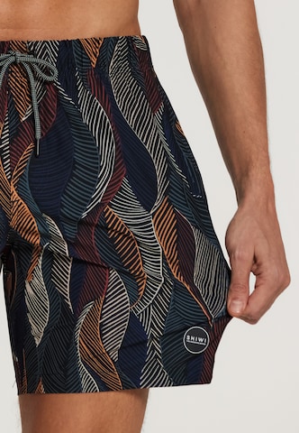 Shiwi Board Shorts 'wild leaves 4-way stretch' in Schwarz