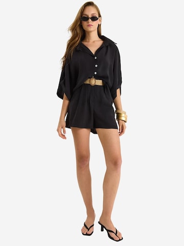 Pantalons de tailleur Bianco Lucci en noir