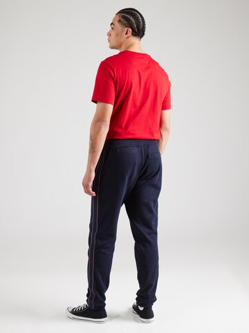 TOMMY HILFIGER Tapered Housut värissä sininen