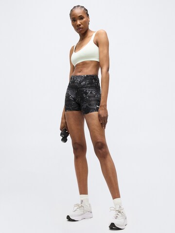 PUMA Skinny Urheiluhousut 'League' värissä musta