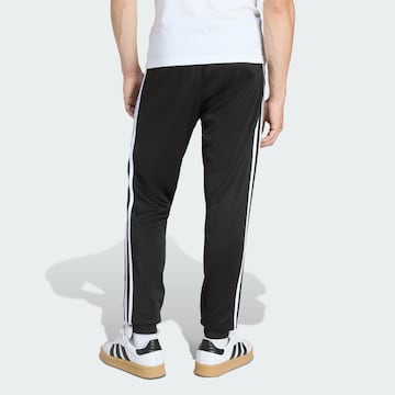 ADIDAS ORIGINALS Дънки Tapered Leg Панталон 'SST' в черно