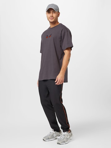 ELLESSE Regular Workout Pants in Black