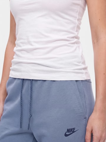 Nike Sportswear Zwężany krój Spodnie 'TCH FLC' w kolorze niebieski