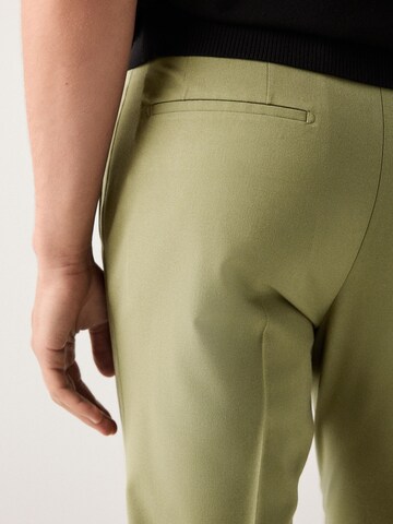 Skinny Pantalon à plis Next en vert