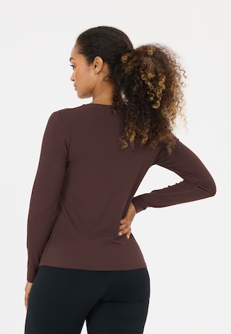 Athlecia Performance shirt 'Tinashe V2' in Brown