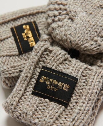 Superdry - Guantes con dedos en beige