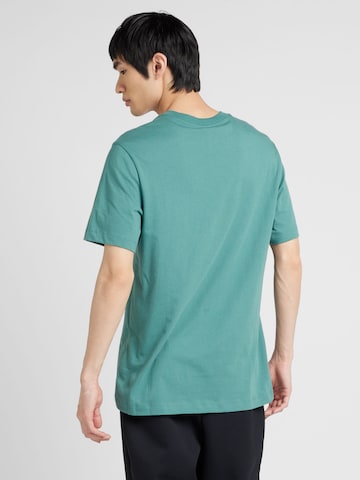Nike Sportswear T-Shirt 'Swoosh' in Grün