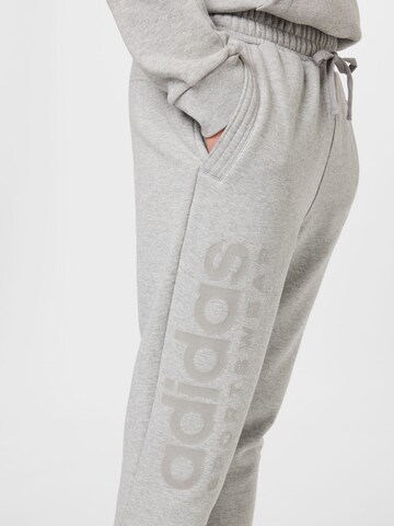 ADIDAS SPORTSWEAR Tapered Workout Pants 'Lounge Fleece' in Grey