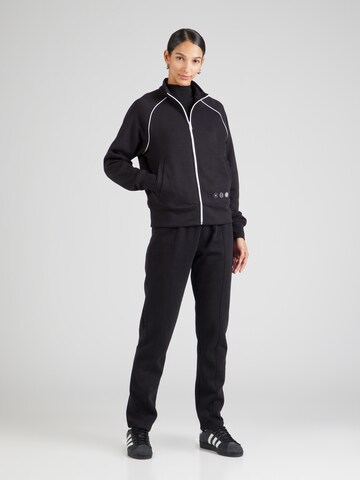 Champion Authentic Athletic Apparel - Chándal 'C-Tech' en negro: frente