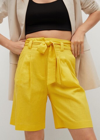 MANGO Szeroka nogawka Spodnie 'Laci' w kolorze żółty: przód