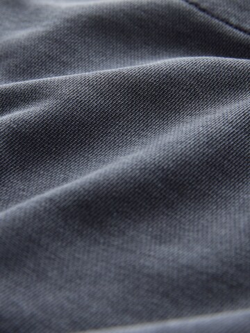 pilka Next Plačios klešnės Kelnės