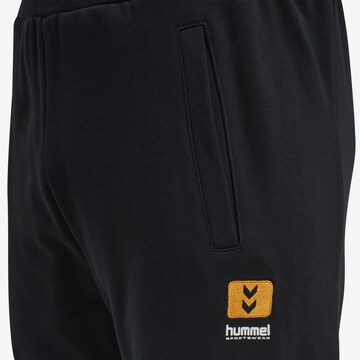 Effilé Pantalon de sport 'Liam' Hummel en noir