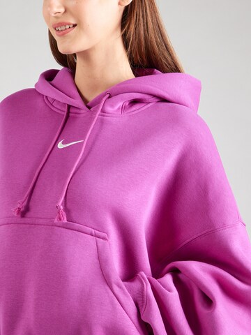 Nike Sportswear Bluzka sportowa 'Phoenix Fleece' w kolorze różowy