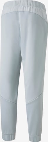 Tapered Pantaloni sportivi 'Train All Day' di PUMA in grigio