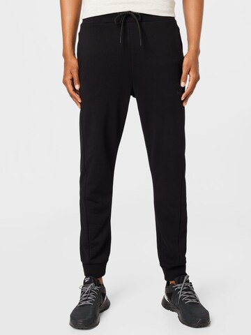Hummel - Tapered Pantalón deportivo en negro: frente