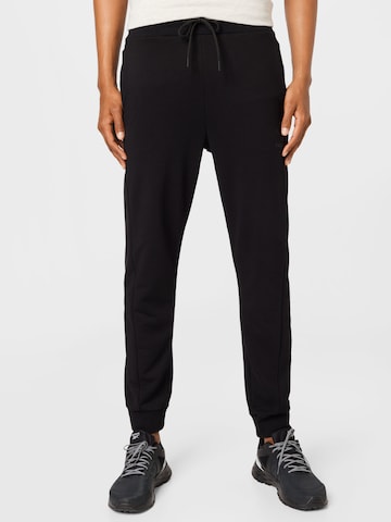 Tapered Pantaloni sportivi di Hummel in nero: frontale