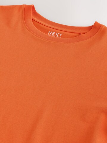 T-Shirt Next en orange