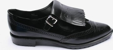 Tod's Flats & Loafers in 40 in Black: front